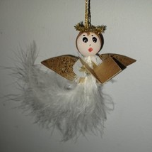5.5” Gold Winged Angel Christmas Ornament White Feather Body - $187.57 MXN