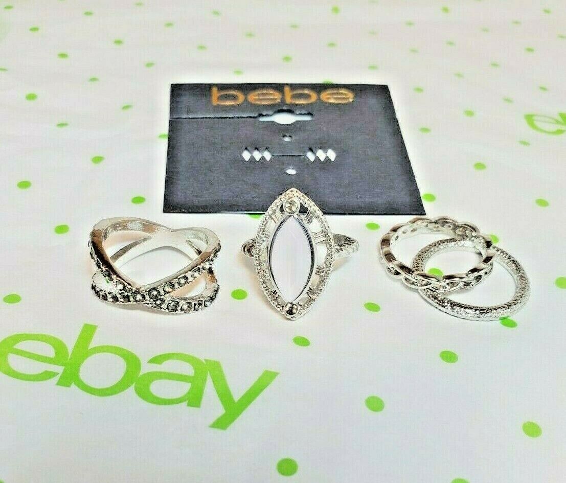 BEBE Women's Silver Tone Bands W White Fashion Ring Set 4 Pieces Size 6.5 New - £12.07 GBP