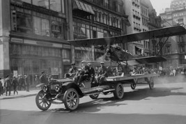 Biplane with spinning propeller is towed down Fifth Avenue New York for July 4th - £17.57 GBP+