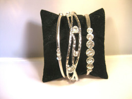 Costume jewelry set of 3 silver tone clear stone bangle bracelets 2 round 1 oval - £7.82 GBP