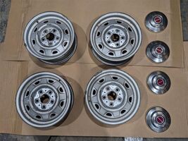 E9TZ1015A set Ford Bronco II Ranger 14" x 5.5" Steel Wheels Rims w Caps ... - $1,187.01