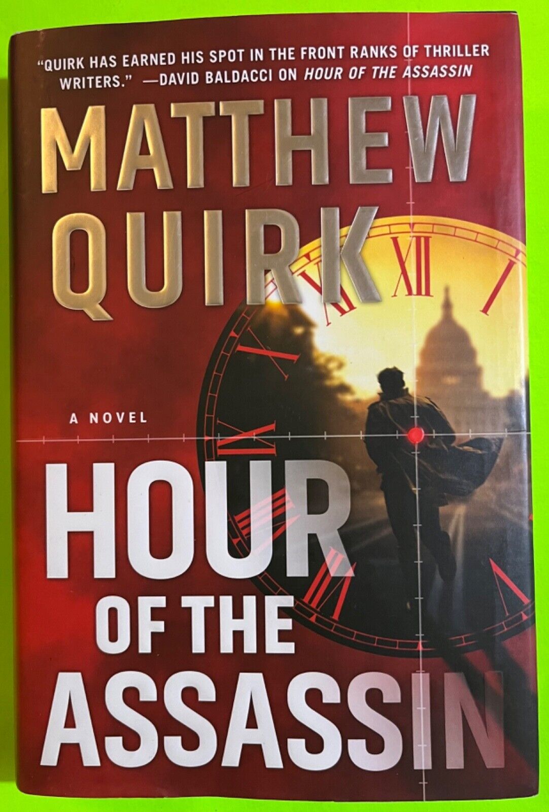 Primary image for Hour of the Assassin: A Novel by Matthew Quirk, WM (HCDJ 2020)
