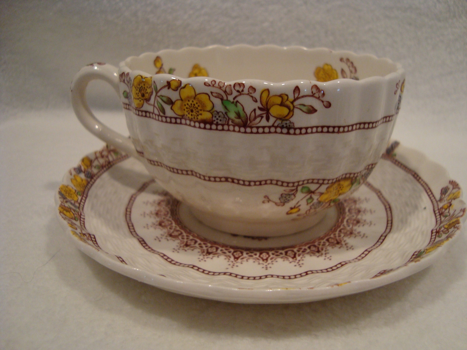 Copeland Spode white porcelain tea cup and saucer in the buttercup pattern. - $25.00