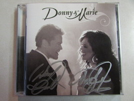 Donnie &amp; Marie 2011 Cd W/BONUS Tracks Hand Autographed 100% Authentic MCPA-25742 - £116.29 GBP