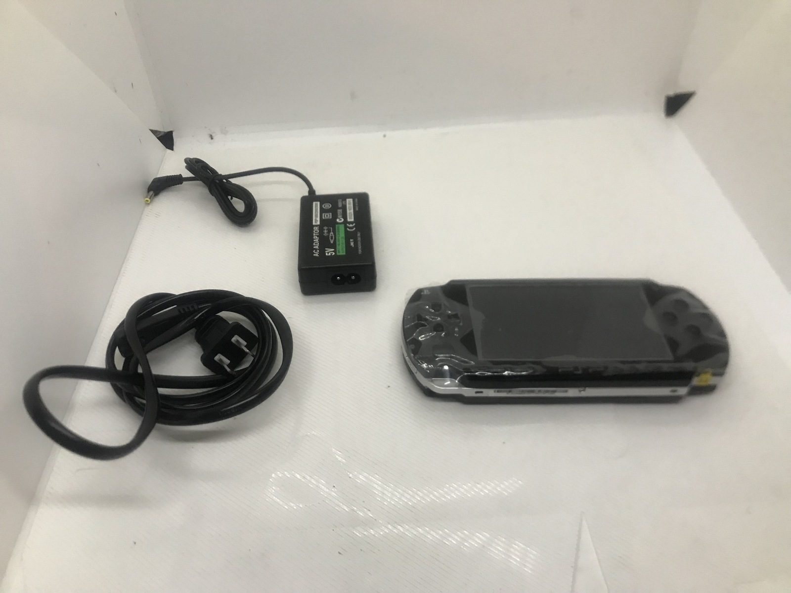 Black PSP 1000 Console W/Charger, 128gb Memory Card Preloaded W  over 5000 Games - $149.00