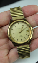 vintage Timex men&#39;s watch HAND WIND gold tone band DATE water resistant ... - £27.41 GBP