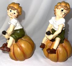 Figurines Lot of 2 Boy Sitting Pumpkin Harvest Time Fall Ceramic Home Decor 5&quot; t - £9.37 GBP