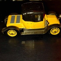 Black and yellow old-timey Corgi classic car - $41.58