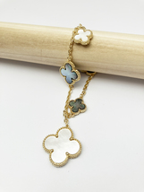 Mixed Mother of Pearl and Onyx Quatrefoil Motif Charm Bracelet in Gold - £59.25 GBP
