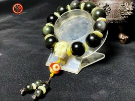 large bracelet Obsidian rainbow and skull beads 18mm, buffalo bone - $1,159.36 MXN