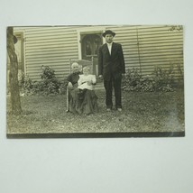 RPPC Photo Postcard Family Outside House Man Woman Baby in Chair Antique c 1910 - £7.85 GBP