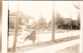 Two Young Ladies Bicycle on Residential Street Women Porch Sitting Postc... - £13.27 GBP