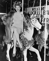 Lucille Ball happily seated legs crossed on carousel in mink 8x10 Photo - $10.99