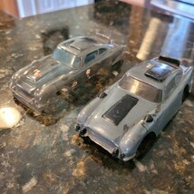 Lot 2 Vintage 1/32 Scale James Bond 007 Aston Martin Clear &amp; Gray Slot C... - $54.69 CAD