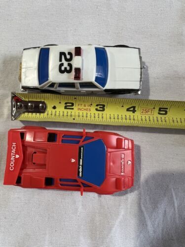 Primary image for SEARS Aurora AFX Road Racing Slot Car only set of 2  police #23 red countach lot