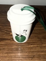 Starbucks travel mug boy on swing Christmas ornament, c. 2015 - $9.79