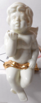 White Ceramic Shelf Sitting Angel Cherub Blowing A Kiss Gold Color Loin Ribbon - £15.81 GBP