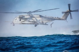 Marine jumps out of Sikorsky CH-53E Super Stallion helicopter Photo Print - $8.81+