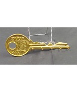 Brass key holder says Paris London - $340.71 MXN