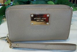 Michael Kors Crossgrain Textured Leather Zip Around Wristlet Wallet Tan - $27.00
