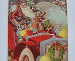 A Merry Christmas Embossed Postcard Santa Claus Driving Big Red Car Toys... - $29.99