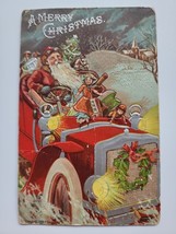 A Merry Christmas Embossed Postcard Santa Claus Driving Big Red Car Toys... - £23.62 GBP