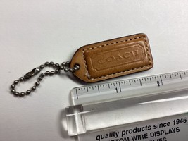 authentic Coach hang tag tan - $9.89