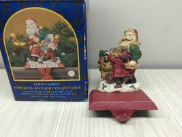 Studio Eluceo Cast Iron Resin Xmas Stocking Holder Santa Child Lantern Cart - $15.42