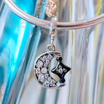 Silver Ruthenium-plated Sparkling Crescent Moon and Spinnable Star Dangle Charm - £13.99 GBP