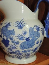 Vintage Pitcher 9+&quot; unsigned Blue &amp; White woman carrying water Sheep Goats - $248.26 MXN