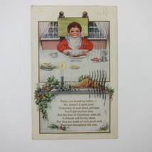 Christmas Postcard Boy Eats Holiday Dinner Candle Holly Embossed Whitney Antique - £4.70 GBP