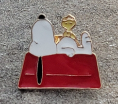 Snoopy and Woodstock on Red Doghouse Roof Sleeping Peanuts Lapel Hat Pin - $11.99