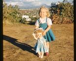 35 mm color slide * 1959 LITTLE GIRL with her DOLL on Hillside view behi... - $5.45