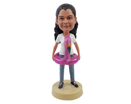 Custom Bobblehead Young lady having fun with her flamingo life saver weaing a t- - £69.62 GBP