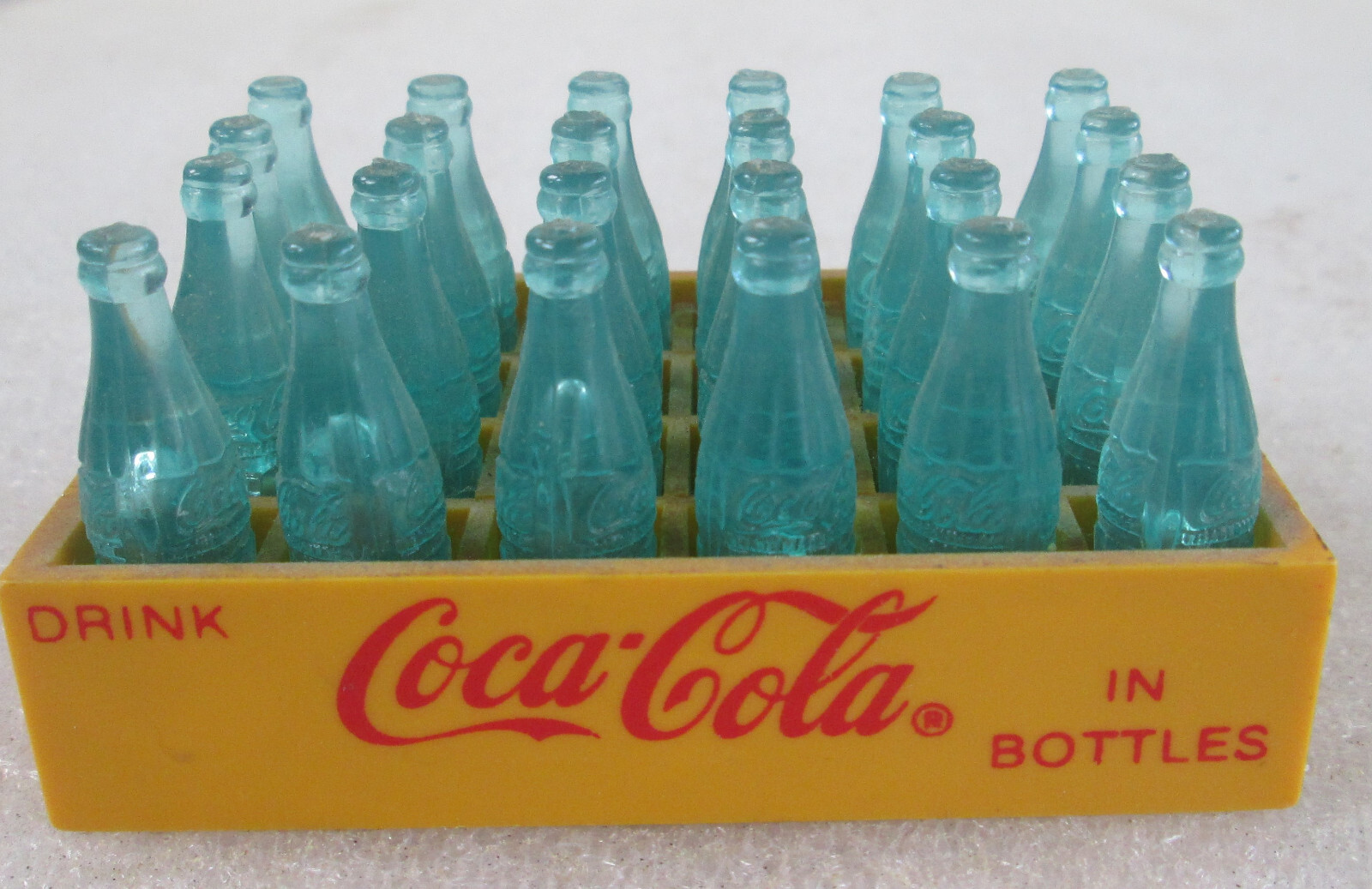1993 Vintage Coca Cola Miniature Coke Bottles 24 Pack w/ YELLOW plastic ... - £20.31 GBP