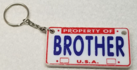 Property of Brother Keychain USA License Plate Plastic 1990s - £8.96 GBP