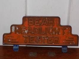 Vintage Bear Headlight Tester Metal Embossed Equipment Topper Sign - $123.75