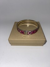 Coach bangle bracelet silver color with pink “C” symbols - $45.00