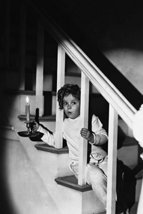 Shirley Temple holding candle on stairs in pajamas 18x24 Poster - £19.77 GBP