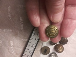 Yves Saint Laurent Button , 15 mm single - $20.00