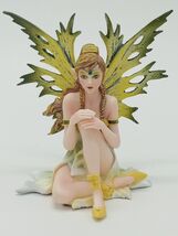 Sitting Green and Yellow Fairy with Ponytail and Braids Collectible Figu... - $43.32