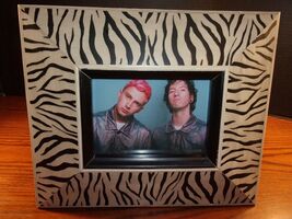 TWENTY-ONE PILOTS IN ZEBRA THEMED WOODEN FRAME MEASURING  11" X 13.5" SI... - $27.29