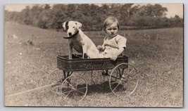 RPPC Adorable Puppy In Pioneer Wagon With Child Real Photo Postcard O21 - £22.67 GBP