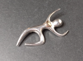 925 Sterling Silver Dancing Figure With Heart - $75.00