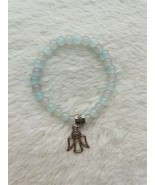 Baby blue, and white glass bead bracelet with angel charm - $7.00