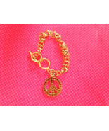 Vintage gold peace sign charm bracelet - €8,65 EUR