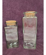 Two glass canisters with cork lids - $32.00