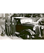 Photo of A couple posing with their car and with the dog next to them  8... - $12.62