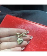 Gold Heart Charm locket with Bow - $283.44 MXN