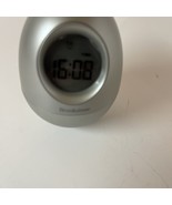 Brookstone “Bob” Silver Oval Egg Wobble Clock 5-in-1 Alarm/Date/Timer/Temp - $246.89 MXN